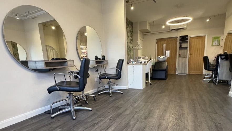 The styling chairs and circular mirrors inside Pure's Ilkley salon